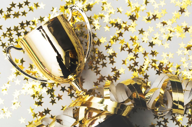 Photo gold winners trophy with golden shiny stars