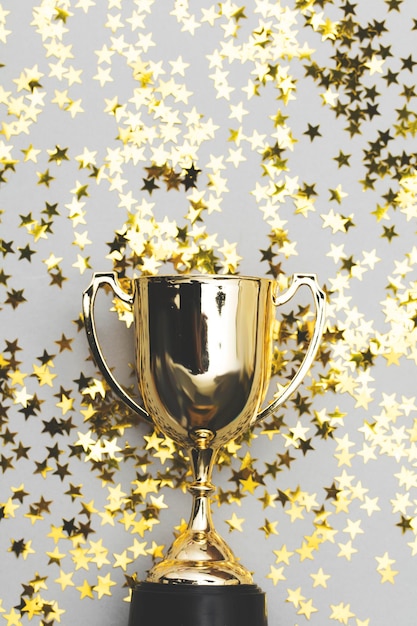 Photo gold winners trophy with golden shiny stars
