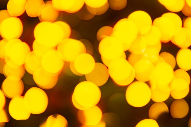 Gold yellow abstract background with bokeh defocused blurred lights