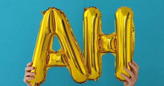 Golden AH word made of inflatable balloons