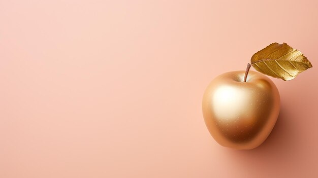 Golden apple with leaf on plain background Minimal style