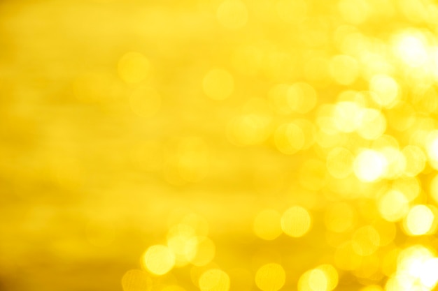 Golden background of defocused abstract lights. golden bokeh lights.