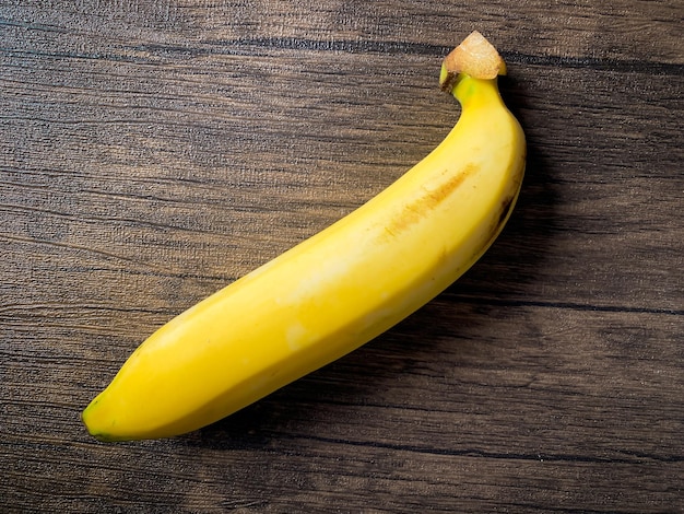 Golden Banana ready to eat on the wooden table