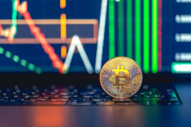 Golden Bitcoin coin on keyboard Stock market trading chart online candlestick