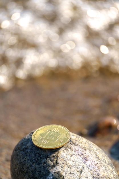 Golden bitcoin coin in natural stones New financial system