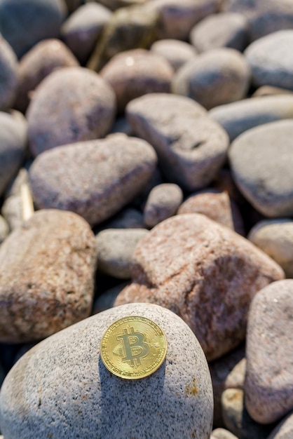 Golden bitcoin coin in natural stones New financial system