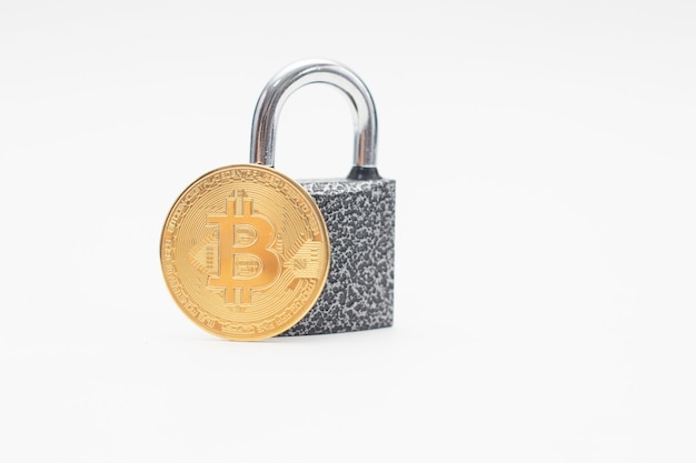 Golden Bitcoin coin and padlock.