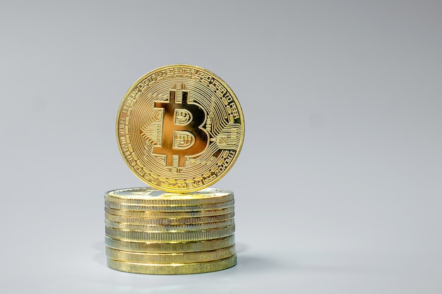 golden bitcoin coin stack on grey background