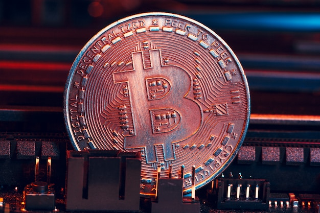 Golden bitcoin and computer chip in 