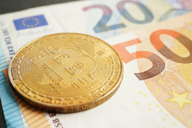 Golden bitcoin on Euro banknotes money for business and commercial Digital currency  cryptocurrency