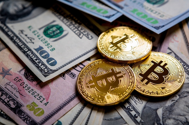 Golden bitcoin on money bills 