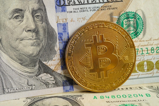 Golden bitcoin on US dollar banknotes money for business and commercial Digital currency