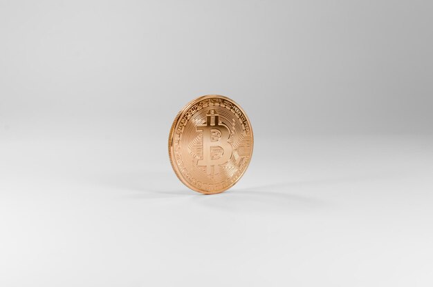 Golden bitcoin virtual coins on white backgroundFinancial growth concept