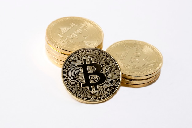 Golden Bitcoins on a white background 