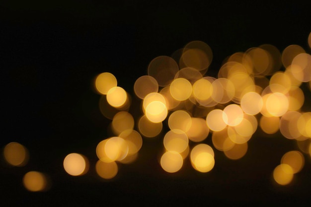 Golden blurred and defocused bokeh lights background