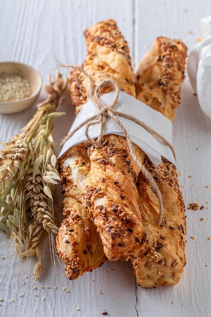 Golden bread sticks baked with sesame seeds