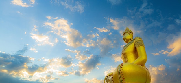 Golden buddha,Big Buddha statue outdoors,The giant golden Buddha. The large buddha statue with sunse