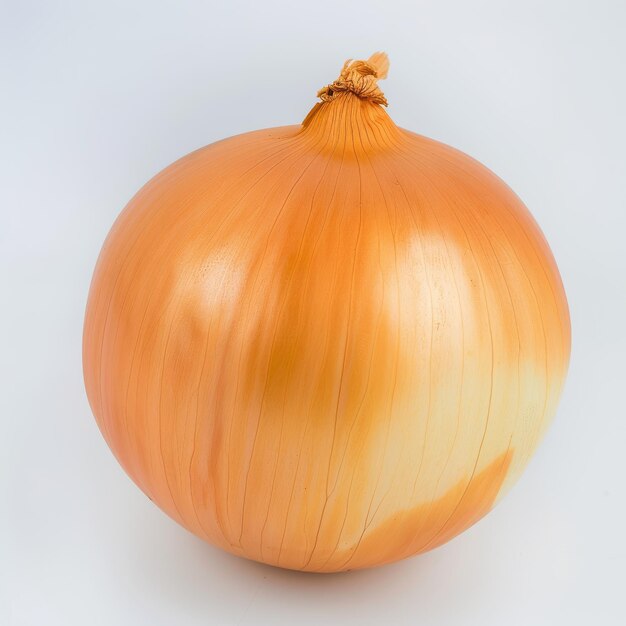 Photo the golden bulb of the ripe onion is isolated on a white background