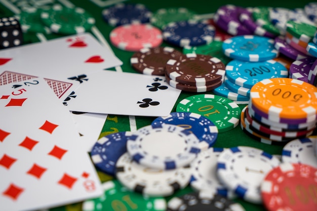 Photo golden casino theme. casino roulette, poker chips on a gaming table