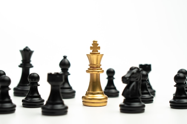 Golden Chess King standing to Be around of other chess, Concept of a leader must have courage and challenge in the competition, leadership and business vision for a win in business games