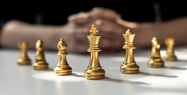 Golden chess pieces lined up in front, business planning ideas and operational strategies to make the business profitable and growing. Strengths in business operations.