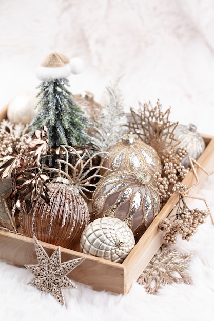 Golden christmas cozy balls with wool background.