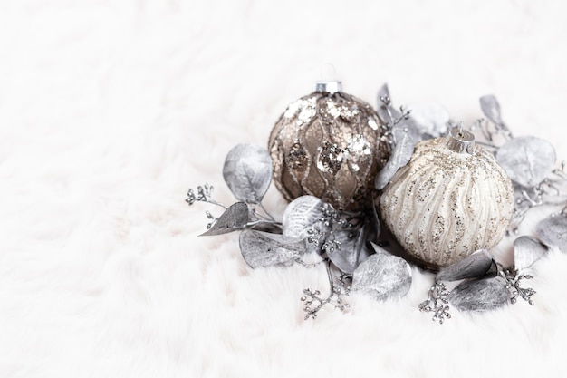 Golden christmas cozy balls with wool background.