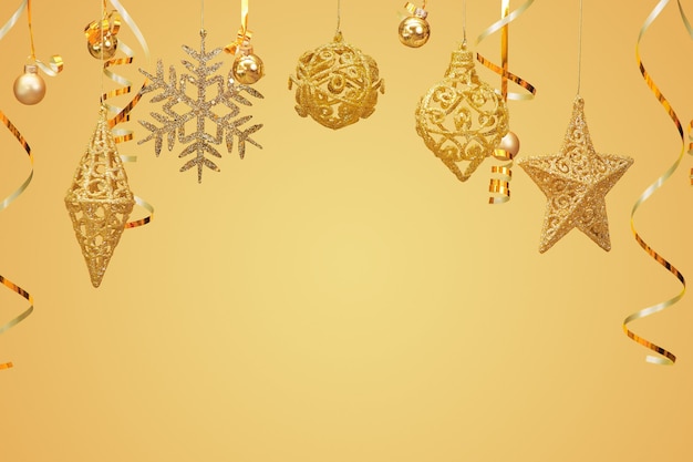 Golden Christmas ornaments isolated on yellow