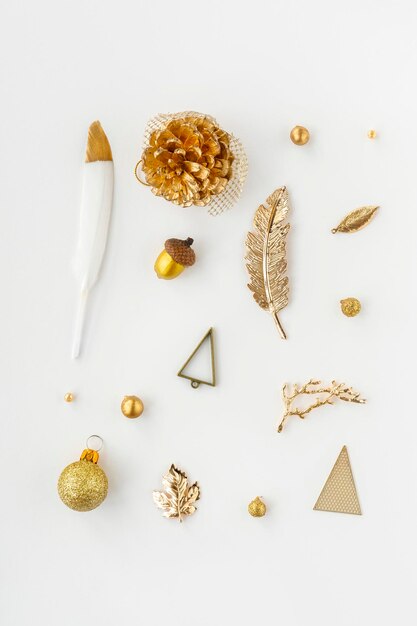 Golden Christmas ornaments on a white background