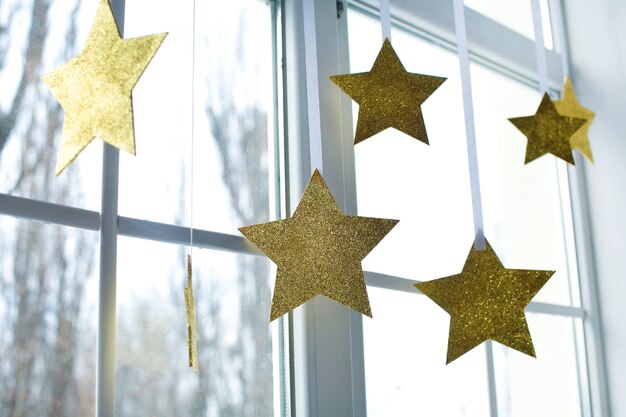 Golden Christmas stars on the window