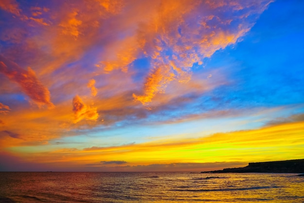 Golden clouds at sunset over the sea