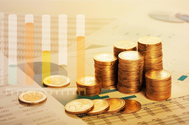 Golden coins stacks on wooden table