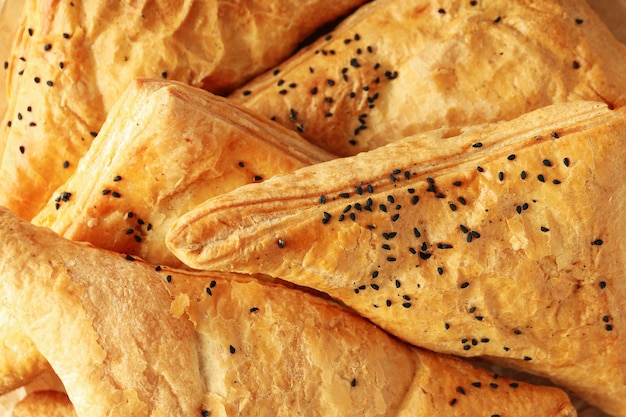 Golden crispy samsa all over background, close up