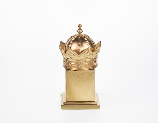 golden crown on stand isolated on white background