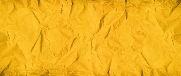 Golden crumpled paper surface