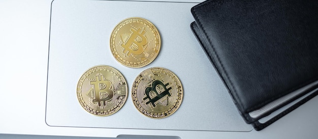 Photo golden cryptocurrency and wallet on keyboard laptop bitcoin coin crypto is digital money within the blockchain network