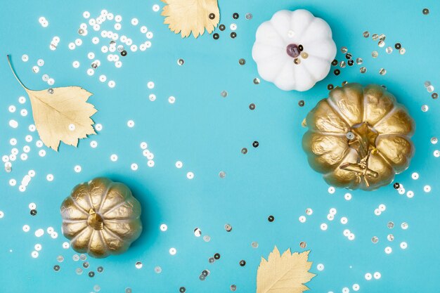 Golden decorative pumpkins and sparkles frame