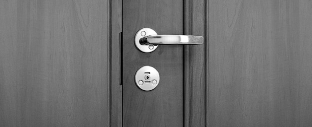 The golden doorhandle in the hotel background with copy space