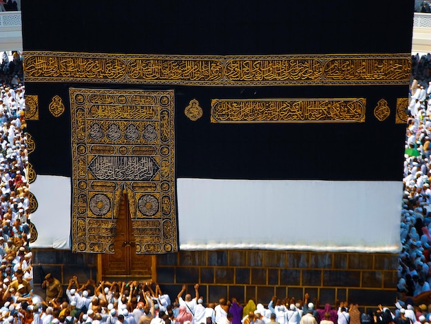 The golden doors of the Holy Kaaba closeup covered with Kiswah Massive lock on the doors