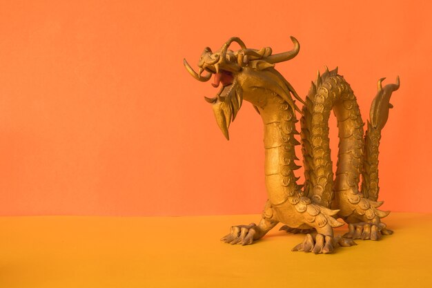 Photo golden dragon statue is a symbol of wealth and power in the faith of chinese