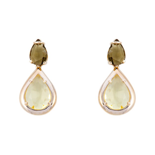 Photo golden earrings with gemstone isolated on white surface