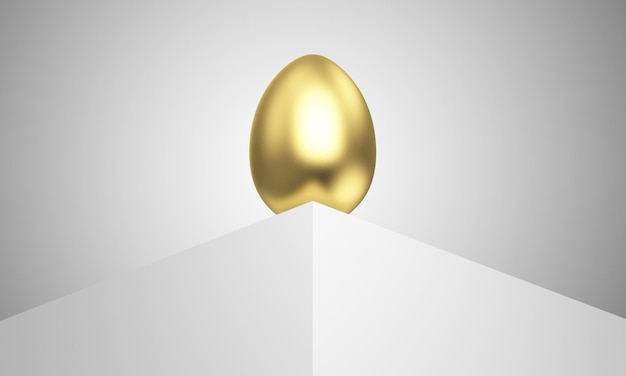 Foto un uovo d'oro si trova su una superficie bianca.