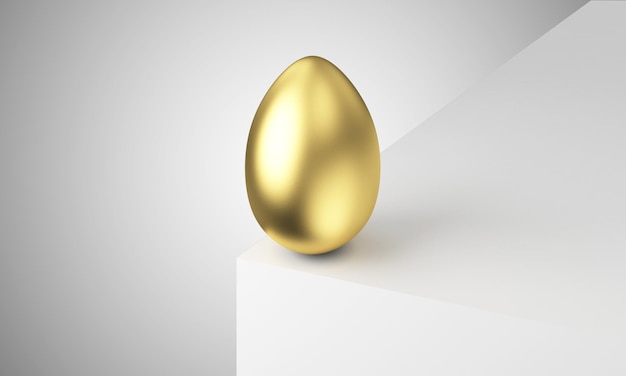 Foto un uovo d'oro su una superficie bianca