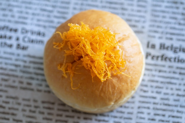 Golden egg yolk threads on bread