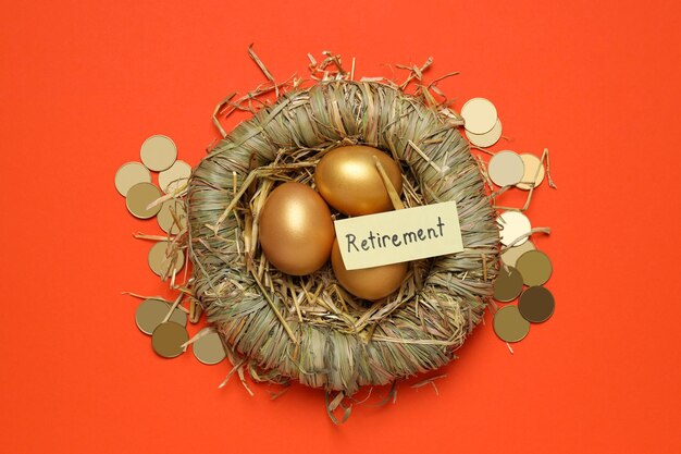 Golden eggs with coins in a straw nest