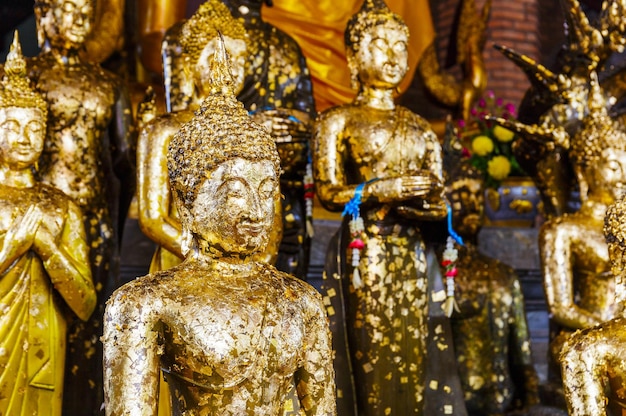 Golden foil on buddha statue