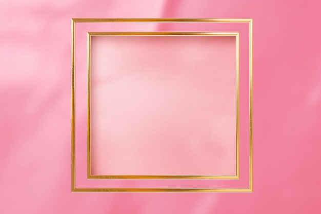 Golden frame on pink abstract background