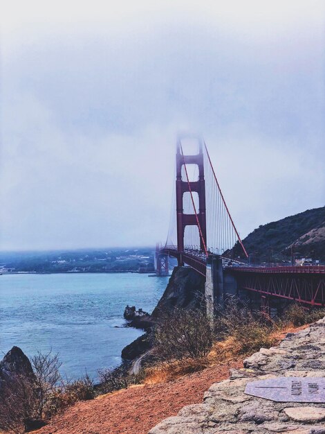 Golden gate bridge over sea against sky