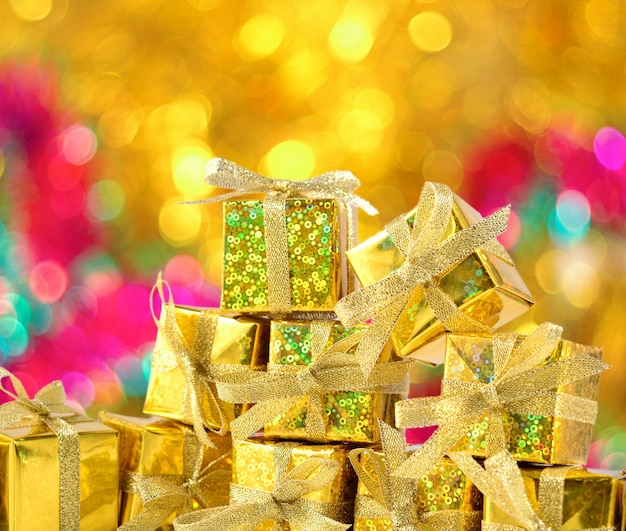 Golden gifts close-up on a bokeh background