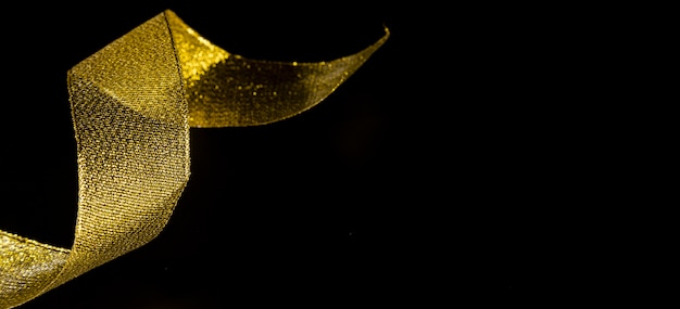 Golden glistening glitter ribbon with copy space